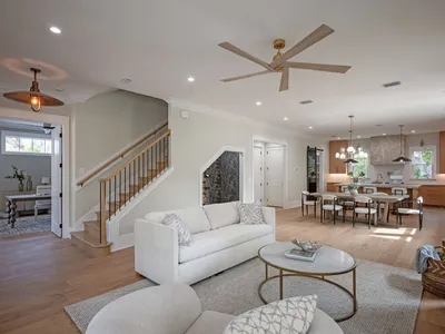 Open-concept living room flowing into the dining area and kitchen