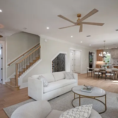 Open-concept living room flowing into the dining area and kitchen