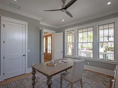Study with bay windows overlooking the front porch and street