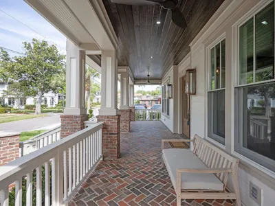 Covered brick front porch with classic Avondale street views